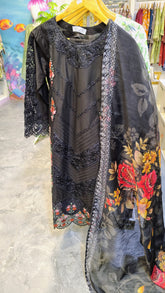 Elegant black embroidered lawn 3-piece suit with printed dupatta by Fashion Street, showcasing intricate embroidery and vibrant fabric details.