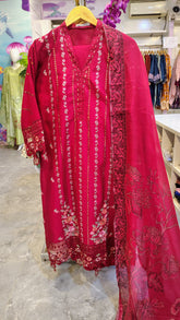 Red embroidered lawn suit with intricate classic design, featuring detailed craftsmanship from Fashion Street.