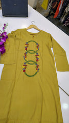 Mustard Elegance embroidered lawn kurta by Fashion Street with intricate embroidery and traditional design, displayed on a hanger.