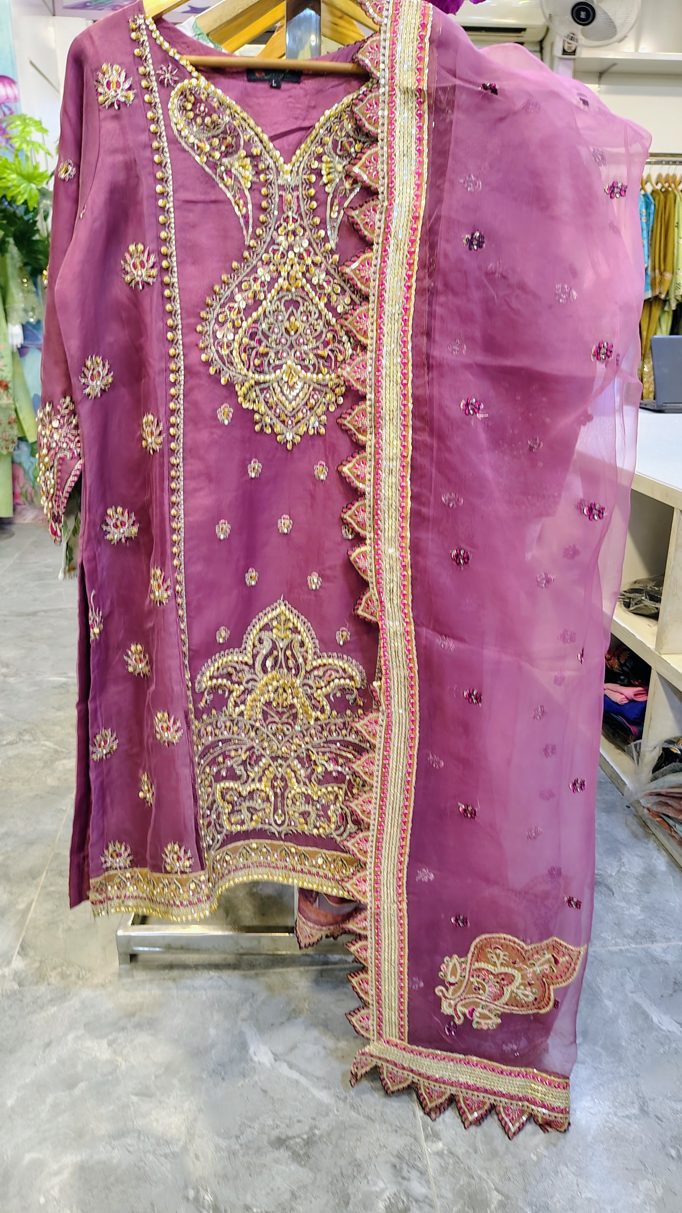 Luxury plum party wear suit from Fashion Street, featuring intricate embroidery and elegant fabric for special occasions.