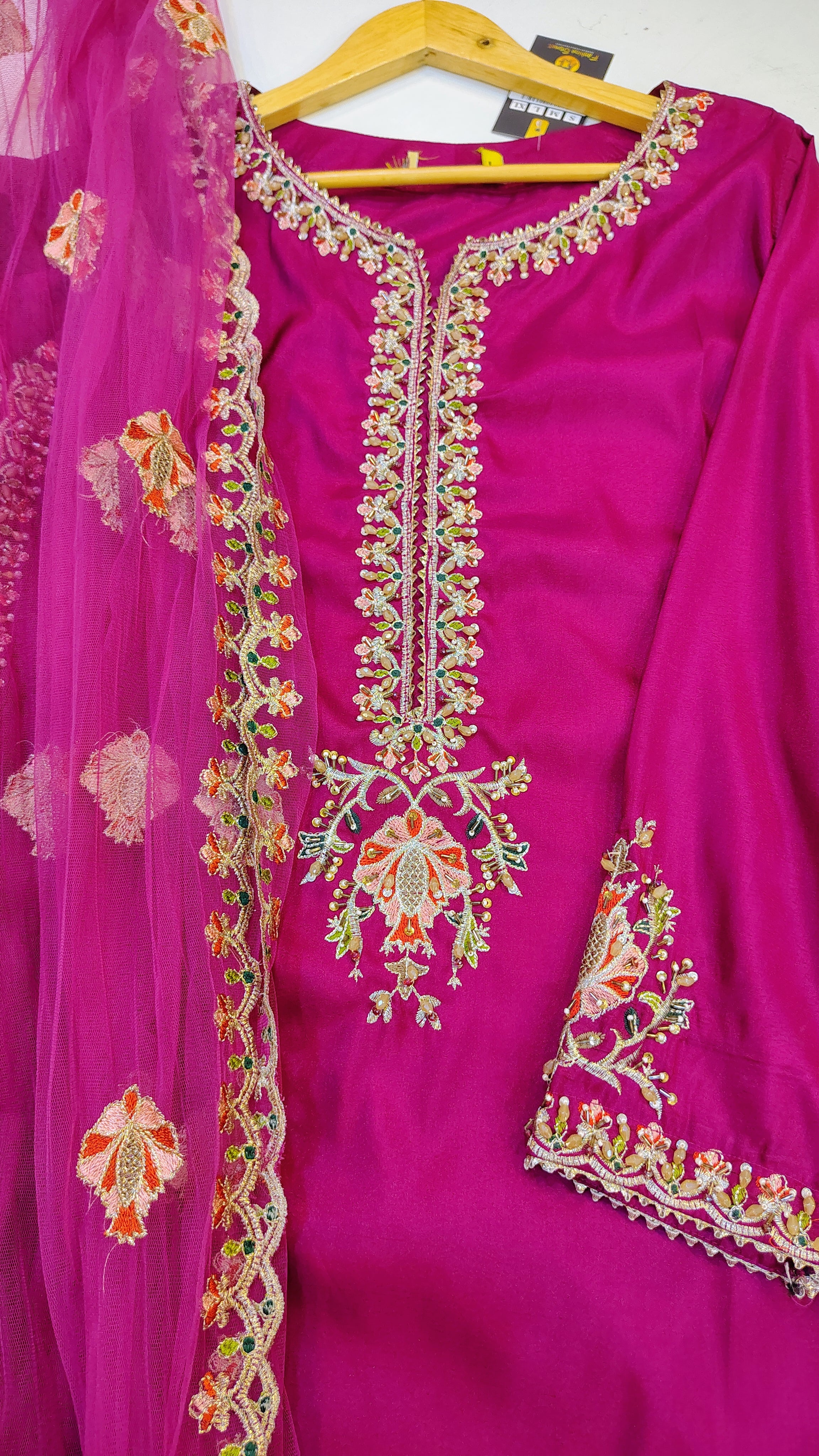 Elegant embroidered party wear suit by Fashion Street, showcasing intricate embroidery and stylish fabric design.