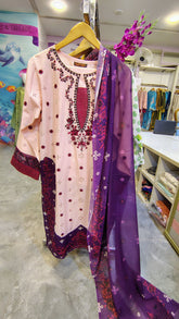 Elegant peach lawn suit with purple embroidery from Fashion Street, featuring intricate embroidery and lightweight fabric.