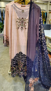 Elegant peach and blue embroidered lawn suit with intricate embroidery, styled by Fashion Street, showcasing detailed fabric and design.
