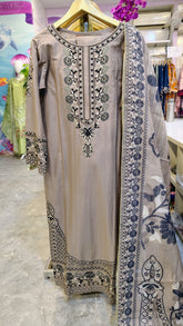 Heavy embroidered lawn suit with 3 pieces from Fashion Street, featuring intricate embroidery and vibrant fabric details.