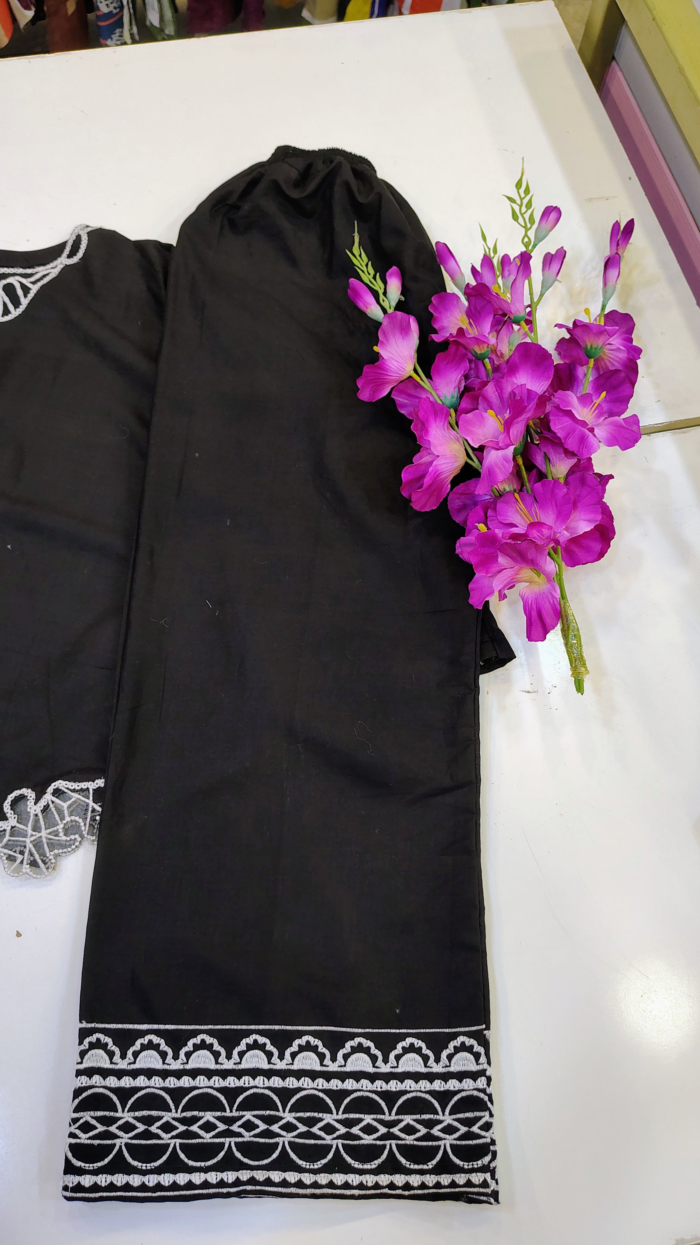 Black embroidered top set from Fashion Street, featuring intricate embroidery and stylish design, displayed on a hanger.