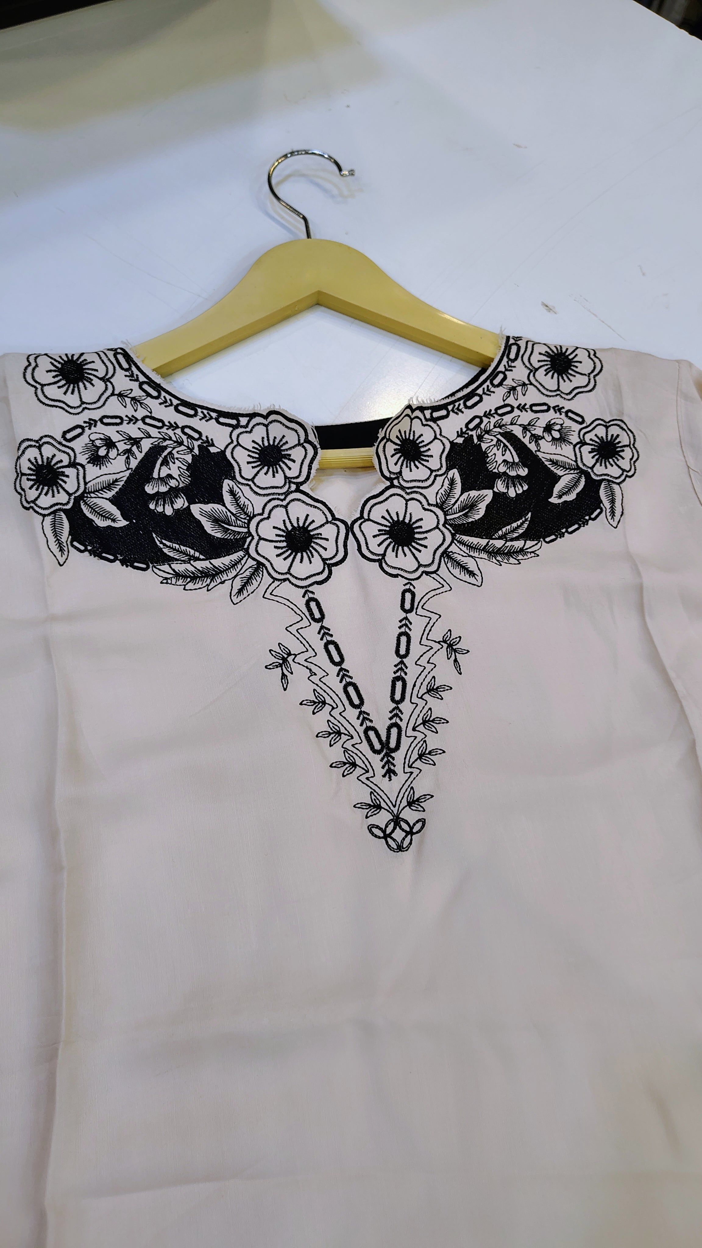 Off-White Length Lawn Kurta by Fashion Street with black embroidery, showcasing intricate embroidery on lightweight lawn fabric.
