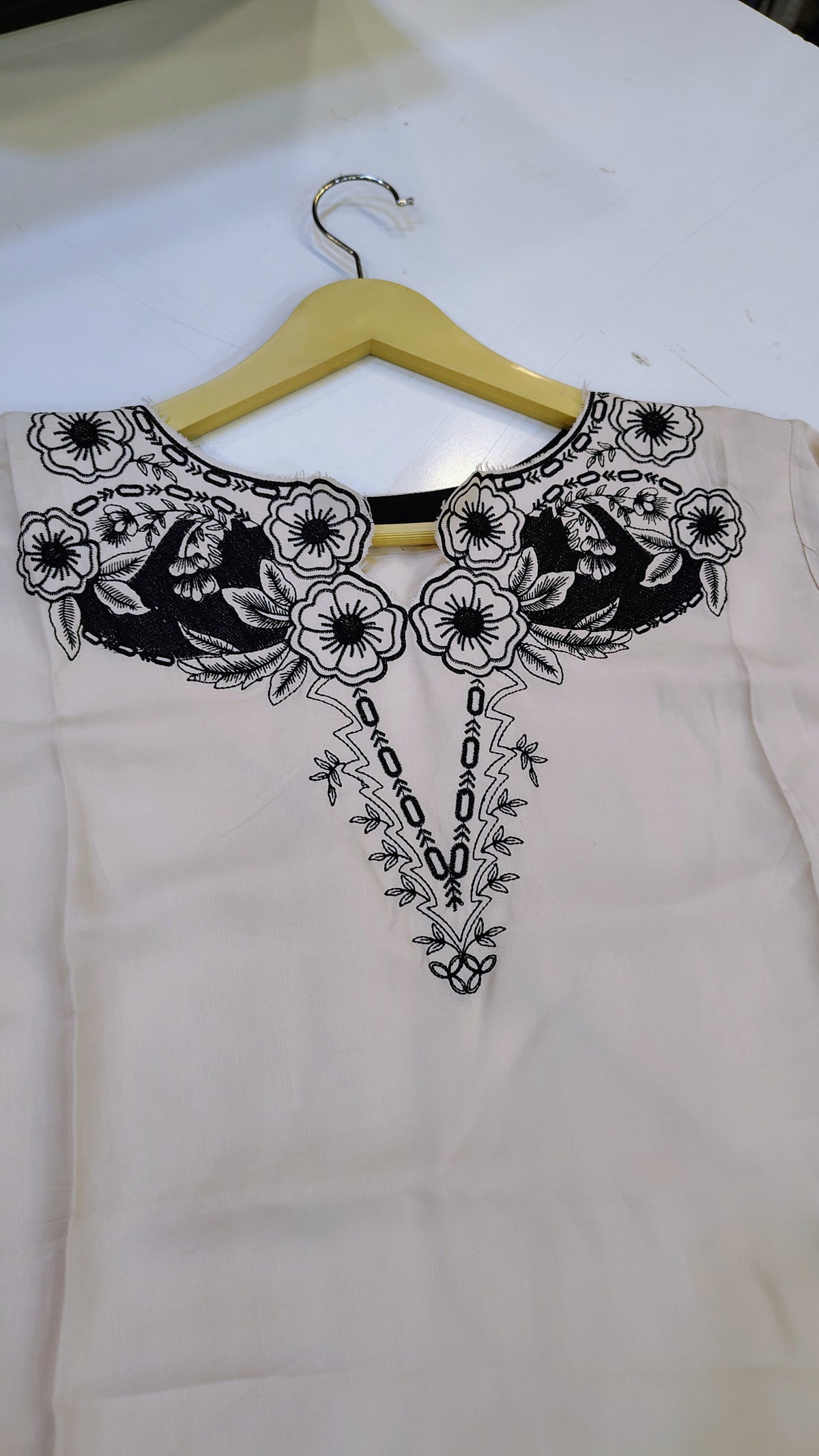 Off-White Length Lawn Kurta by Fashion Street with black embroidery, showcasing intricate embroidery on lightweight lawn fabric.