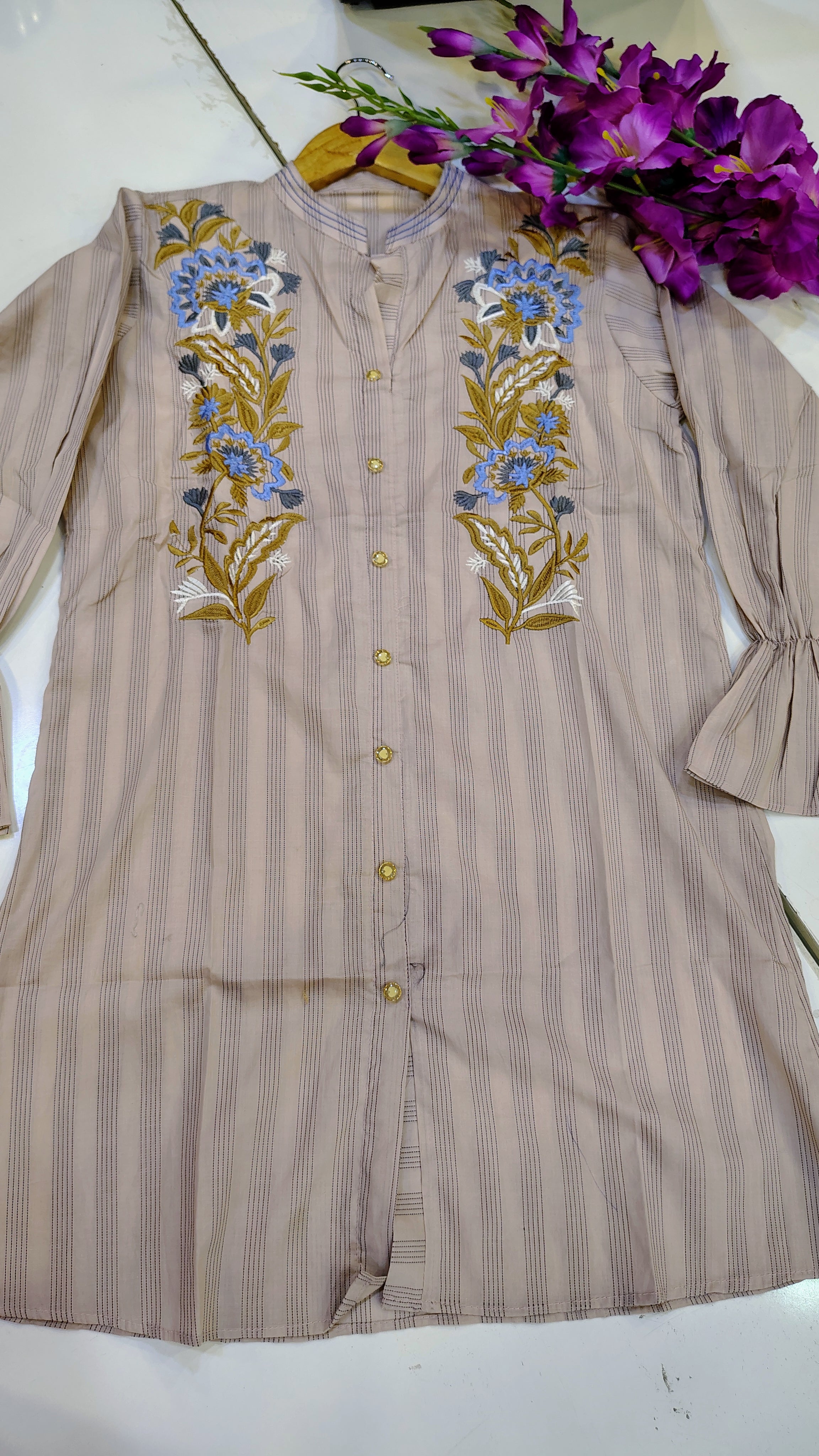 Elegant short-length lawn kurta from Fashion Street featuring intricate embroidery and vibrant colors, perfect for summer wear.