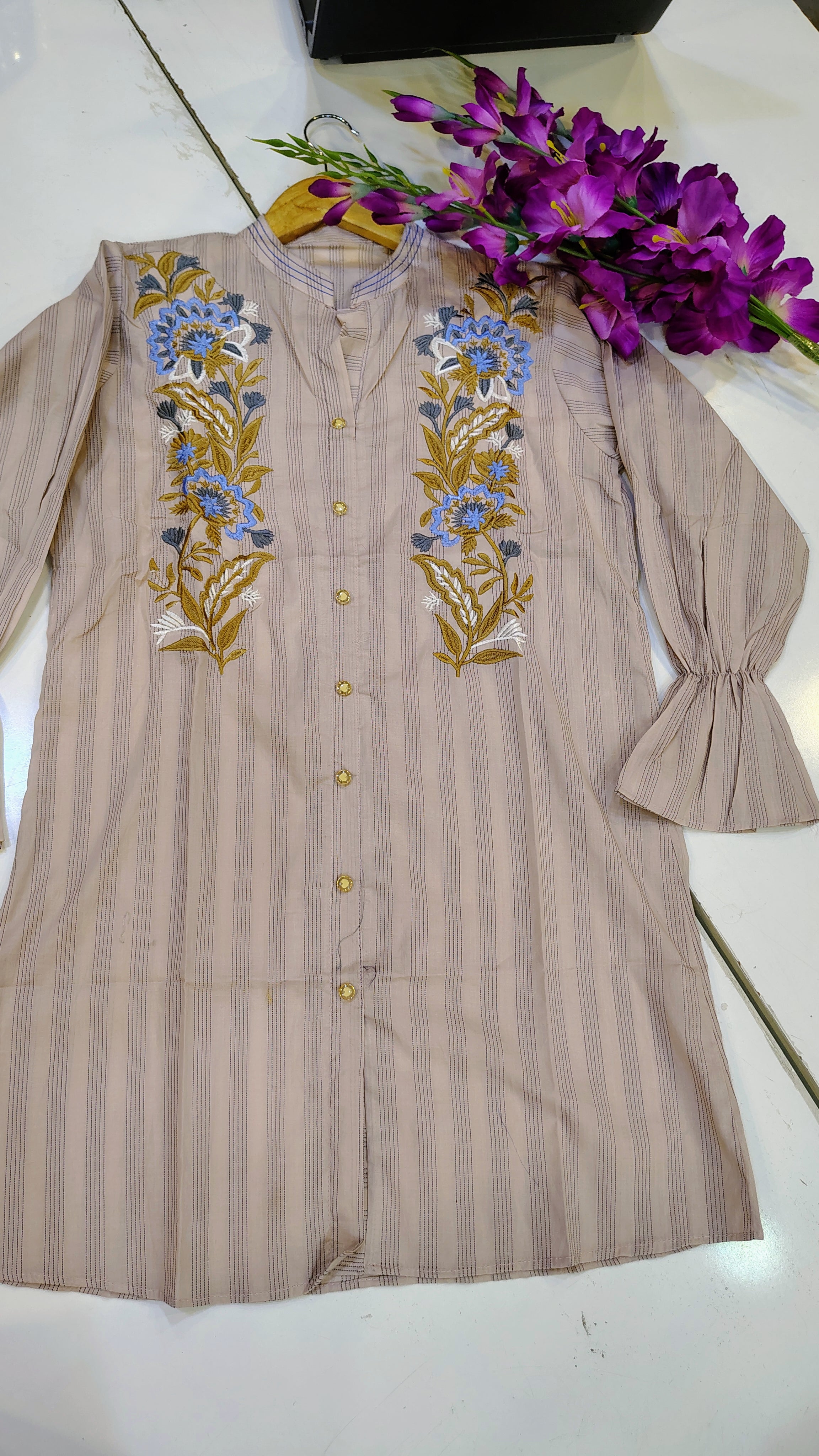 Elegant short-length lawn kurta by Fashion Street featuring intricate embroidery and vibrant fabric, ideal for casual or festive wear.