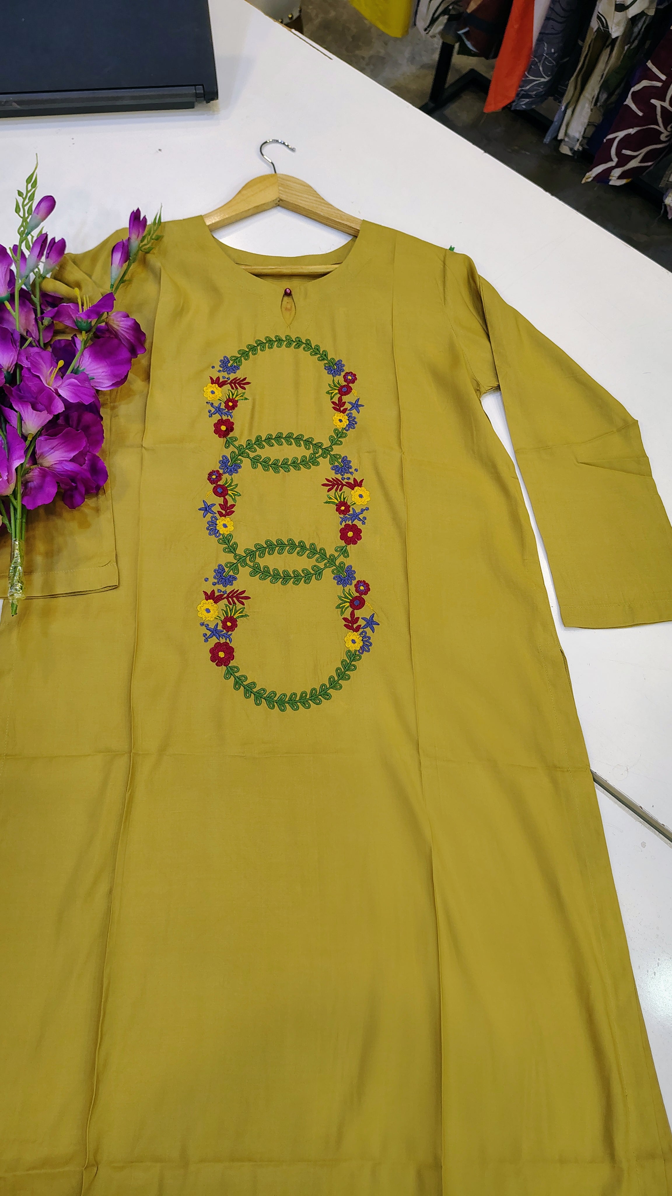 Elegant mustard embroidered lawn kurta by Fashion Street, showcasing intricate embroidery and lightweight fabric.