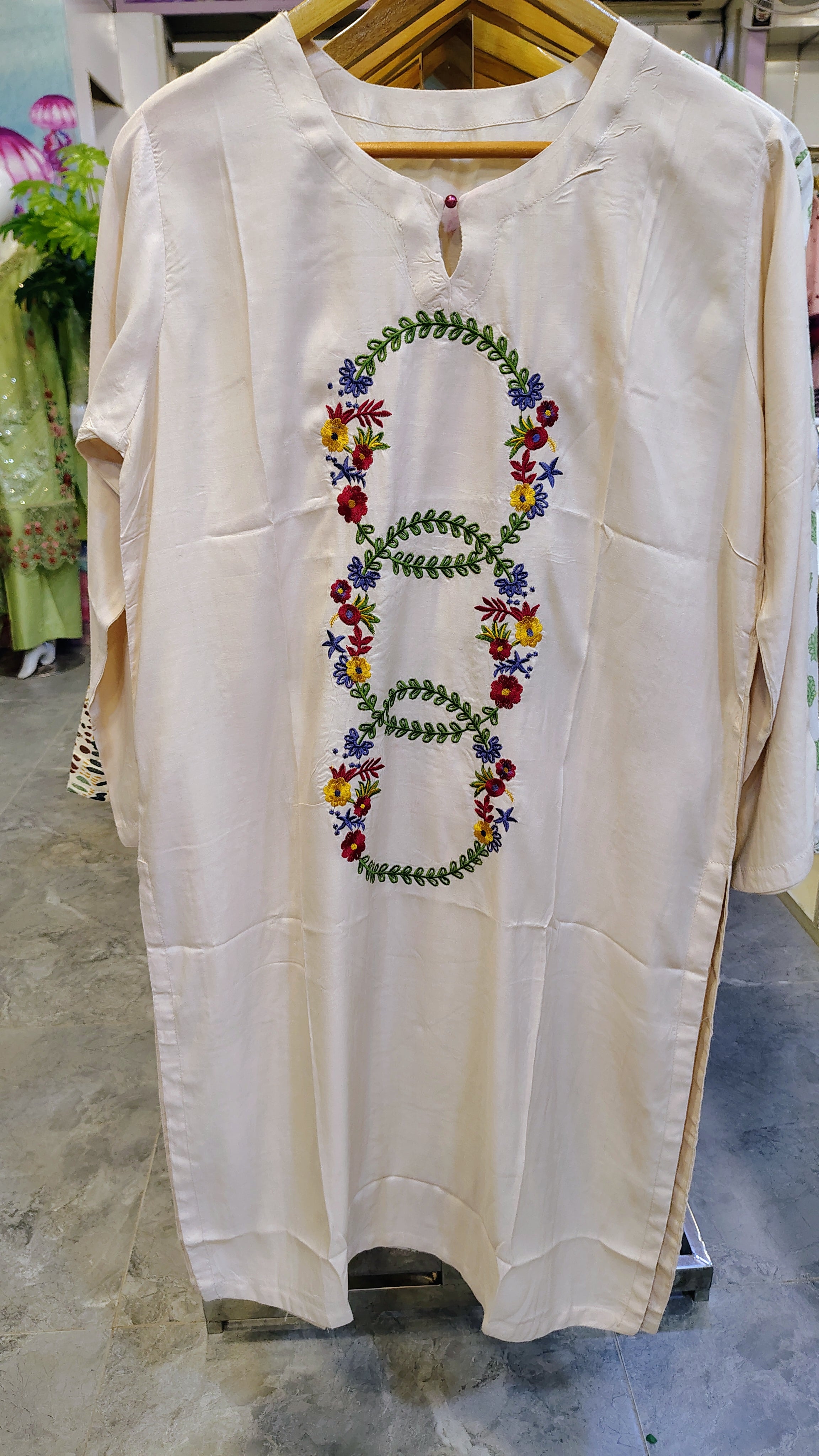 Off-White Long Embroidered Lawn Kurta from Fashion Street, showcasing detailed embroidery and elegant design on soft fabric.
