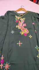 Elegant green embroidered lawn kurta with intricate detailing, showcasing a stylish and traditional fashion piece.