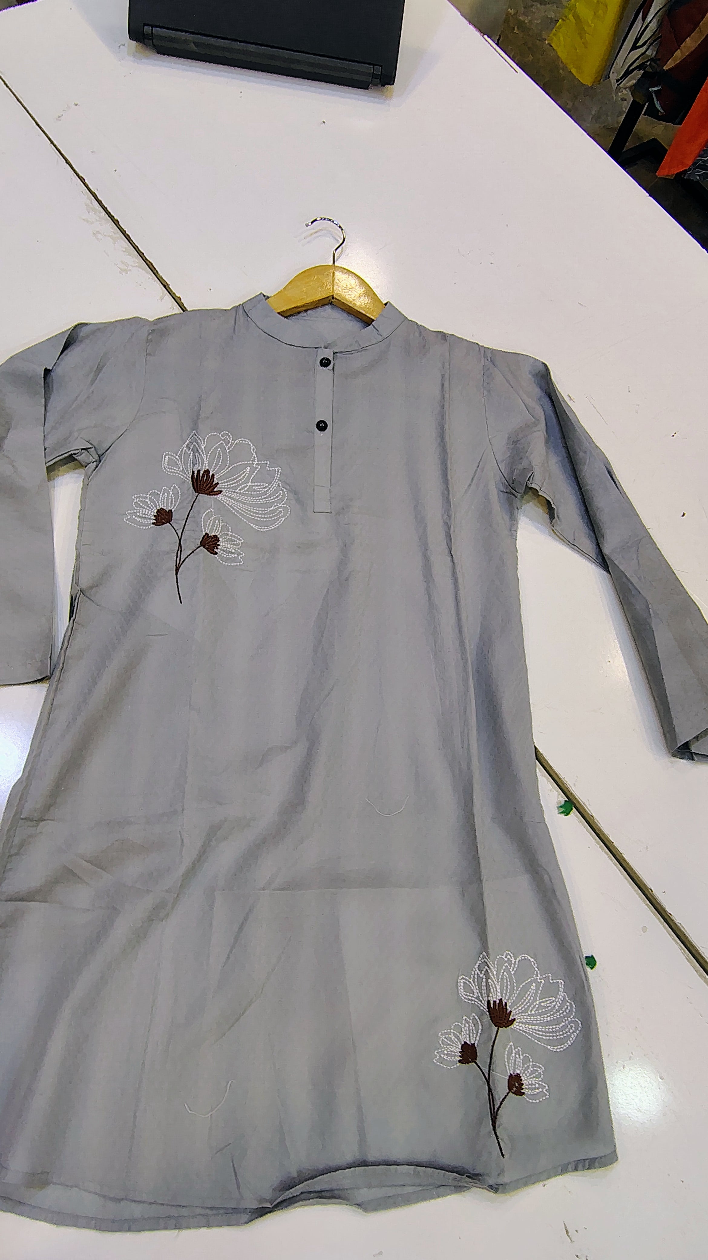 Short length embroidered lawn kurta from Fashion Street, showcasing intricate embroidery and lightweight fabric in a vibrant design.