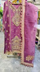 Luxury plum party wear suit from Fashion Street, featuring intricate embroidery and elegant fabric for special occasions.