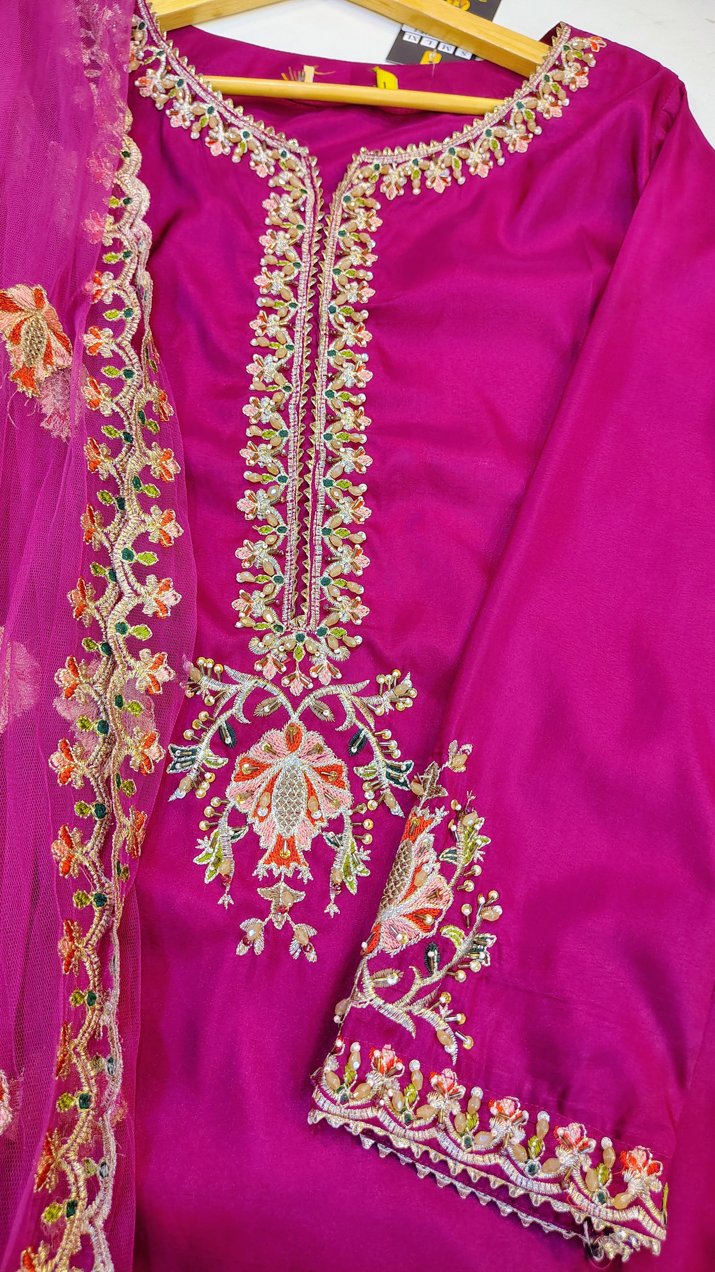 Elegant embroidered party wear suit by Fashion Street, featuring intricate designs and vibrant fabric for special occasions.