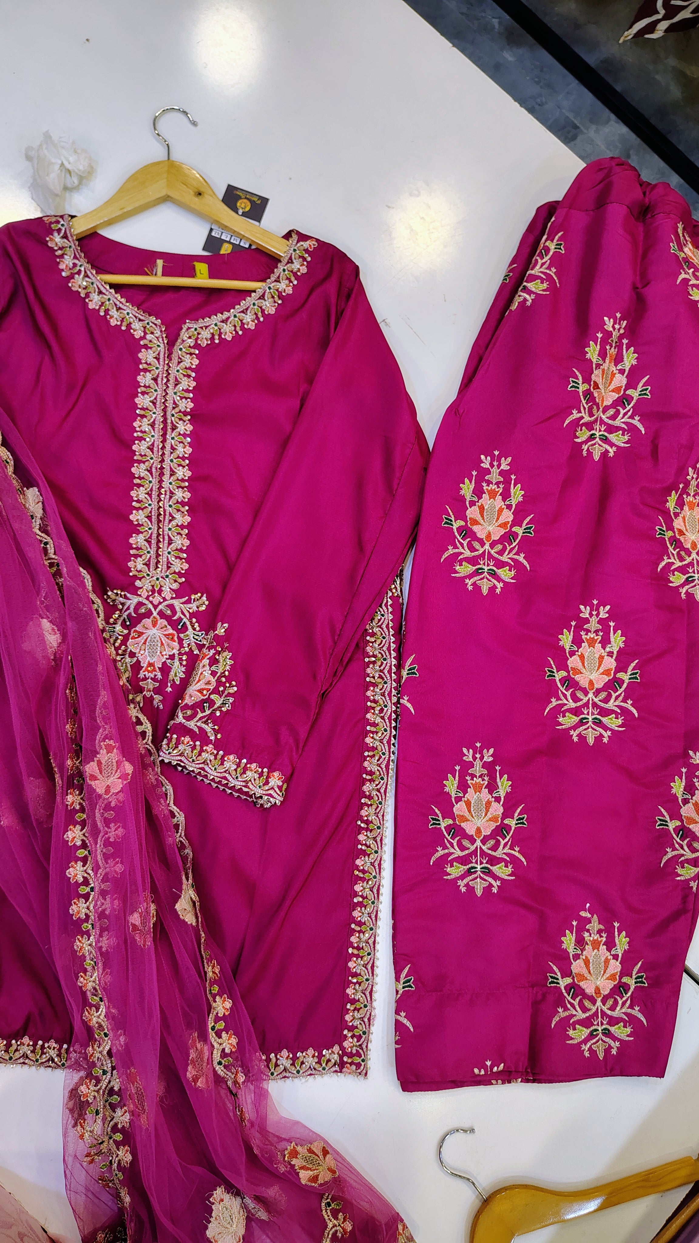 Elegant embroidered party wear suit by Fashion Street, featuring intricate embroidery and stylish design on a traditional fabric.